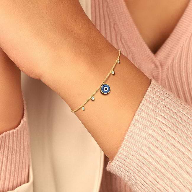 Evil eye bracelet shop gold caratlane