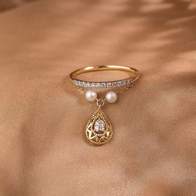 Dangling pearl ring store